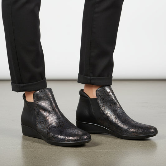 Lifestyle image for Damascus Wedged Boot - Black Metallic Python/Onyx