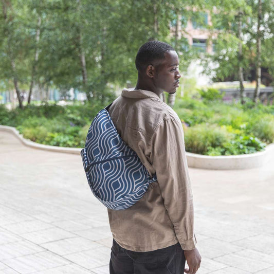 Lifestyle image for Reversible Print Backpack Medium - Blue Wave